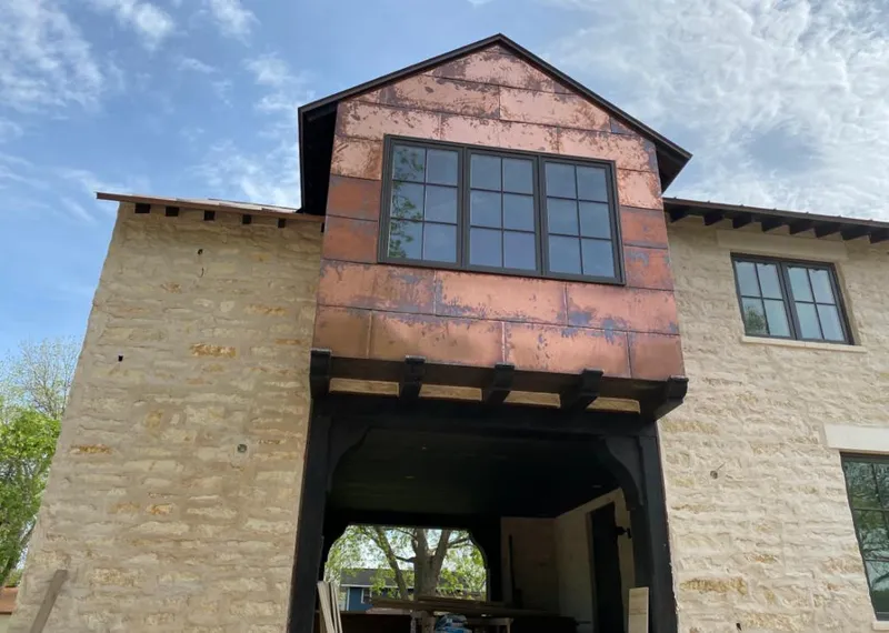 Copper metal panel facade on a stone building for Skylight Installation in Solebury