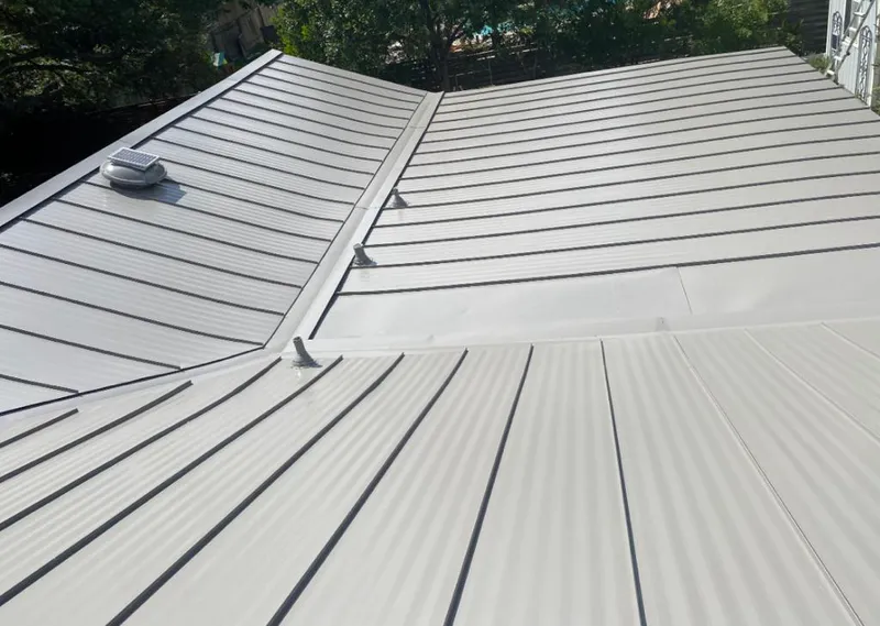 Solar attic fan installed on a metal roof for Roof Ventilation in Solebury